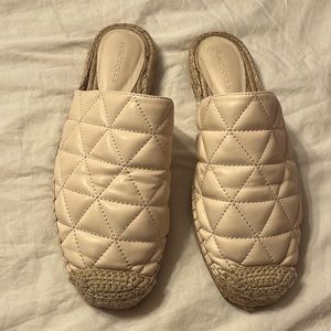 Stunning unique mules with an espadrille looks at the tip.